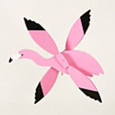 a pink and black paper flamingo on a white background