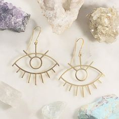 Handmade third eye statement earrings for enlightenment Bohemian Evil Eye Earrings As Gift, Spiritual Metal Plug Earrings As Gift, Adjustable Gold Evil Eye Earrings, Mystical Brass Earrings As Gift, Symbolic Metal Earrings For Festival, Mystical Metal Earrings With Ear Wire, Symbolic Drop Earrings For Festivals, Unique Evil Eye Jewelry For Festival, Symbolic Evil Eye Jewelry For Festival