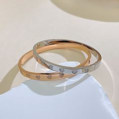 Pattern: Heart Shape Occasion: Daily Color: Rose Gold, White Quantity: 1 Piece Material: Titanium Steel Gender: Women's Design: Inlay Classification: Bangle Style: French Style, Simple Style Inlay Material: Zircon Weight: 22g Rose Gold White, Bangles Style, White Design, French Style, Heart Shape, Simple Style, Heart Shapes, 1 Piece, Bangles