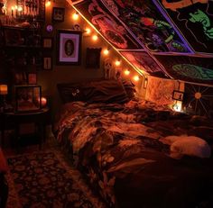 a bed with lots of lights on it in a room filled with pictures and decorations