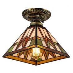 a light fixture with a stained glass shade