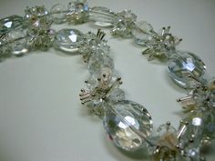 "This necklace is an elegant piece for that special day. It is full of large crystals, round faceted crystal balls, and then separated by smaller crystals and fresh water pearls in a jumble of movement. This necklace is 19\" (48.2 cm) in length and closes with a toggle clasp. Purchase two of these necklaces to twist together for a fuller look. I am also making this one in other colors, so let me know if you are looking for something specific and I'll work on that color next. Great price or some Faceted Round Bead Necklaces For Wedding, Wedding Faceted Round Bead Necklaces, Wedding Crystal Necklaces, Crystal Necklaces With Faceted Beads For Wedding, Faceted Crystal Necklaces For Wedding, Faceted Crystal Necklace For Wedding, Silver Bridal Necklace With Faceted Beads For Wedding, Wedding Pearl Necklace With Faceted Beads, Clear Crystal Necklace For Weddings