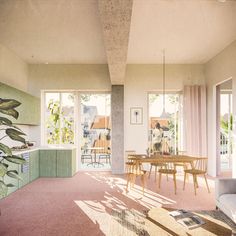 a living room filled with furniture next to a dining room table and window covered in curtains