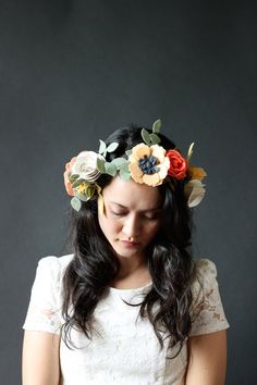 a woman wearing a flower crown on her head