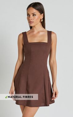 Get ready to turn heads in the Adiana Mini Dress! This linen look square neck dress in chocolate is perfect for those casual days out or fun festival adventures. The shirred back and A-line silhouette create a flattering fit, while the sleeveless design keeps you cool and comfortable all day long. Made from a blend of linen and cotton, this dress not only looks amazing but feels great too. With its versatile style and earthy brown color, it's easy to see why the Adiana Mini Dress is a must-have Tailored Clothes, Square Neck Dress, Brown Dress, Linen Dresses, Fabric Squares, Festival Wear, Square Neck, Day Dresses, A Line Dress