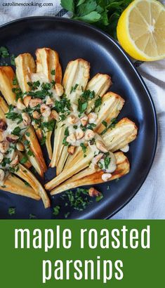 this is an image of maple roasted parsnips on a plate with lemon wedges