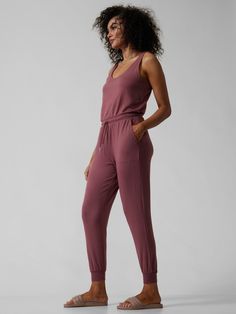 FOR: Layering up to and from your workout or lounging FEEL: Lightweight French Terry feels incredibly soft on the skin FAVE: Adjustable bungee cords on waist make your fit easy to customize� Semi-fitted, skims easily over the body One piece long ro Athleisure Activewear For Lounging With Drawstring, Athleisure Activewear With Drawstring For Lounging, Stretch Drawstring Lounging Activewear, Stretch Activewear With Drawstring For Lounging, Sporty Activewear With Elastic Waistband For Relaxation, Functional Stretch Jumpsuits And Rompers For Loungewear, Jumpsuit Pink, Bungee Cords, Pink Jumpsuit