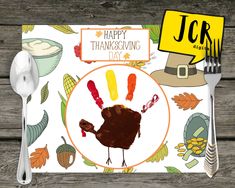 a thanksgiving placemat with a turkey on it and a happy thanksgiving card in the middle