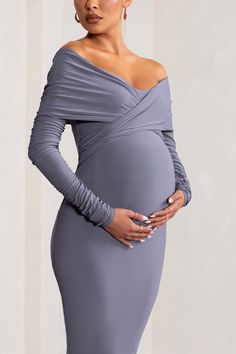 Add sophistication to your maternity wardrobe with this stunning mid-length gown. babe. Designed to contour your curves. our "Little Star" maternity midi dress is the gown you need to show off your gorgeous bump. babe. Fabricated in a premium stretch-jersey. and worked in a classy dove grey colour. this figure-hugging design will sculpt your silhouette. The twist-front detail adds a feminine edge and the Bardot neckline enhances your bust. Where to WearGorgeous for dinner dates. baby shower. wed Maternity Midi Dress Bump Friendly, Fitted Maternity Dress Midi Length, Fitted Midi Length Maternity Dress, Dinner Date Dress, Classy Baby Shower, Maternity Wardrobe, Maternity Midi Dress, Oversized Clutch, Bardot Neckline