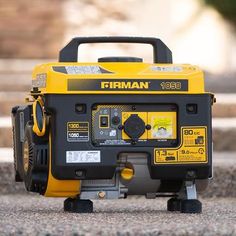 a yellow and black portable generator sitting on the ground