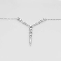 Metal Quality: 14k White Gold Diamond Shape: Round Diamond Total Weight: .74 Carats Diamond Clarity: SI 1 (Excellent) Diamond Color: G (Excellent, Near Colorless) Short Station Lengths: 23.39 millimeters / .92 inches each Long Station Length: 29 millimeters / 1.14 inches Chain Type: Cable Chain Length: 18 inches Clasp: Lobster Clasp Chain Diameter: 1 millimeter Formal Fine Jewelry Lariat Pendant Necklace, Classic Formal Drop Necklace With Diamond Accents, Formal Fine Jewelry Lariat Necklace With Pendant, Timeless White Gold Necklace For Evening, Timeless White Gold Evening Necklace, Timeless Diamond Cut Necklace For Evening, Timeless Evening Diamond Necklace With 17 Jewels, Timeless Evening Necklace With Diamond Cut, Fine Jewelry White Gold Drop Necklace For Anniversary