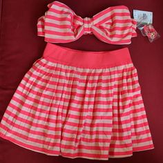 Nwt Kate Spade Georgica Beach Stripes Bow Halter Or Bandau Top (Halter Strap Is Detachable) In Size M (Msrp $98) With Matching Skirt In Size Xs (Msrp $98). Color Is Geranium- Hot Pink With Light Pink Stripes. Never Worn! Skirt Is 14 Inches Long, Elastic Waist Is 12 Inches Flat, Unstretched And 16 Inches Flat, Stretched. Pinup, Vintage Feel. No Defects That I Can Find. Please Ask Questions. Make Me An Offer! Tags: Vintage Victorian Edwardian Bridgerton Romantic Retro Classic Y2k Free People Anthr Summer Bandeau Lined Swimwear, Lined Bandeau Swimwear For Summer, Casual Bandeau Sets For Summer, Striped Lined Swimwear For Summer, Chic Beach Sets For Beach Season, White Sets For Poolside Spring Season, Chic Beach Set For Beach Season, White Kate Spade Swimwear For Spring, Striped Spring Beachwear Swimwear