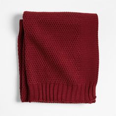 a red knitted scarf on a white background