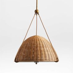 a hanging light made out of wicker