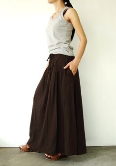 "🚚..ALL ORDERS ARE SHIPPED VIA DHL EXPRESS MAIL Too cool for words! A slighty a-line skirt with two front pockets, pleated front detail, adjustable drawstring at covered elastic waistband that can be worn on waist or hips and shell buttons at hemline of front and back, you can arrange it to be a harem pants. This 2 in 1 style can be worn as either a skirt or a harem pants. Made of our super fine cotton for easy comfort. Torn between fashion and comfort? Well, that's exactly the point. * flare s Casual Full Length Brown Skirt, Brown Cotton Gathered Skirt Bottoms, Brown Cotton Bottoms With Gathered Skirt, Brown Cotton Full Skirt, Casual Full-length Pleated Maxi Skirt, Casual Full Length Pleated Maxi Skirt, Brown Full-length Maxi Skirt, Full Length Brown Relaxed Fit Skirt, Brown Cotton Maxi Skirt With Lined Skirt