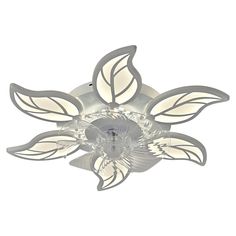 a white ceiling light with leaves on the top and one light in the middle that is dimmer