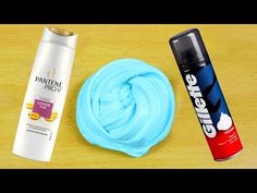 two different types of hair care products on a table with one tube of blue and the other