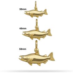 three gold fish pendants with measurements for each one, and the other two are shown