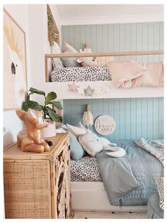 a bedroom with two bunk beds and some animal pillows on the bed, next to a dresser