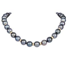 Elevate your jewelry collection with this exquisite Estate Tahitian Pearl Necklace, featuring 35 lustrous Tahitian pearls. Each pearl is elegantly separated by round 18k slider disks,  adorned with 128 natural round diamonds, approximately 3.20carat G-H color, and VS1-VS2 clarity adding a sparkling contrast to the deep, iridescent hues of the pearls. The necklace is secured with a robust magnetic gold clasp, ensuring both safety and ease of wear. Perfect for sophisticated gatherings or adding a touch of luxury to everyday attire, this timeless piece combines classic elegance with contemporary flair. Ideal for those seeking high-end, luxury pearl necklaces, it is a must-have for discerning collectors and fashion aficionados alike. Metal:18k  Excellent Condition Accompanied by a gemologist a Luxury Everyday Beaded Necklaces With Round Beads, David Yurman Necklace Bloomingdale's, Luxury High Luster Tahitian Pearl Necklace, Luxury Tahitian Pearl Jewelry With Pearl Charm, Elegant Tahitian Pearl Necklace For Formal Occasions, Luxury Single Strand Tahitian Pearl Necklace, Luxury Tahitian Pearl Single Strand Necklace, Luxury Tahitian Pearl Necklace For Formal Occasions, Formal Yellow Gold Tahitian Pearl Necklace