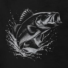 a black and white drawing of a fish on a t - shirt with water splashing around it