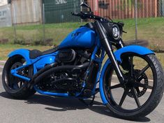 a blue motorcycle is parked on the street