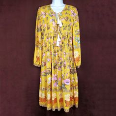 R. Vivimos Tassel Floral Boho Midi Dress In Mustard Yellow, Cream, And Pink. Long Sleeves. Gathered Sleeves. No Stains Or Holes. Flowy Boho Bohemian Dress. Farmcore Dress. No Material Tag. Size: M / 8 / 10 Length: 45" Pit To Pit: 18" Sleeve: 24" Waist: 17" Condition: New With Tag Box N D Mustard Bohemian Maxi Dress, Yellow Floral Print Dress For Festival, Yellow Long Sleeve Bohemian Dress, Yellow Floral Print Maxi Dress For Festival, Yellow Bohemian Maxi Dress For Fall, Yellow Bohemian Dress With Tassels, Mustard Bohemian Flowy Dress, Yellow Bohemian Dress For Fall, Yellow Tassel Beach Dress