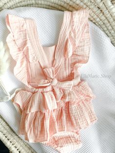 Make your little girl's first birthday sweeter with our adorable cotton muslin romper, perfect for a "One in a Melon" or "Sweet One" theme!  This charming outfit is designed to add a delightful touch to her special day. Crafted with soft muslin fabric, this romper ensures comfort and coziness for your precious one. The tutu ruffle skirt adds a whimsical flair, making it a perfect choice for her birthday celebration. The highlight of this outfit is the beautifully embroidered watermelon, symbolizing sweetness and joy. With the word "one" delicately embroidered alongside the watermelon on the chest, this romper becomes a unique and meaningful piece for her milestone birthday. Capture precious moments and create lasting memories as she twirls and plays in this adorable romper. Perfect for bir Pink Ruffled Bubble Romper For First Birthday, Pink Ruffles Bubble Romper For Cake Smash, First Birthday Cotton Romper With Ruffles, Sweet Cotton Bubble Romper For First Birthday, First Birthday Cotton Bubble Romper With Ruffles, Cotton Bubble Romper For Baptism In Summer, Cotton Bubble Romper With Ruffles For First Birthday, Cute Pink Bubble Romper For Cake Smash, Pink Ruffled Bubble Romper For The Beach