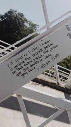 a sign that is on the side of a bridge