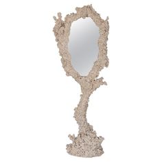 a mirror that is shaped like a tree