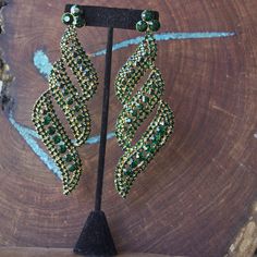 Glamorous Green Chandelier Earrings For Evening, Green Chandelier Earrings For Evening, Green Crystal Chandelier Earrings For Party, Glamorous Green Chandelier Earrings For Wedding, Glamorous Green Crystal Earrings For Party, Green Rhinestone Crystal Earrings For Evening, Green Rhinestone Crystal Earrings For Wedding, Glamorous Green Dangle Chandelier Earrings, Green Crystal Rhinestone Earrings For Wedding