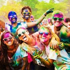 a group of people covered in colored paint