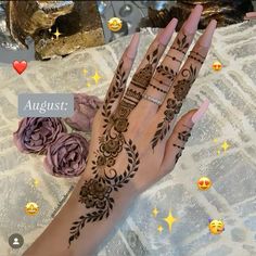 a woman's hand with henna tattoos on it and the words august written in arabic