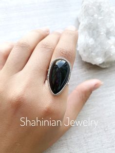 Silver ring with natural black obsidian for women! This ring is a perfect gift idea to the one who loves natural black color of stone and minimalist style) The ring size is adjustable, so you can give a gift without knowing the size! But if you want we can make any size of this ring! Also, we can make matching earrings, pendants, and bracelets! Just message me) Choosing Shahinian Jewelry, you choose the unique design, the best quality, and the perfect look! Ring weight: 10,5 gr ✍️If you have any Black Sterling Silver Crystal Ring, Handmade Black Crystal Ring In Sterling Silver, Unique Black Crystal Ring In Sterling Silver, Black Crystal Gemstone Ring For Gift, Black Cabochon Ring As A Gift, Black Cabochon Ring For Gift, Black Crystal Ring With Gemstone For Gift, Handmade Black Oval Crystal Ring, Unique Black Crystal Gemstone Ring