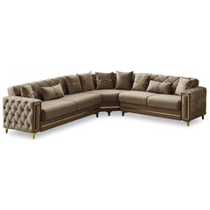 a large sectional couch with many pillows on the top and bottom corner, in beige fabric