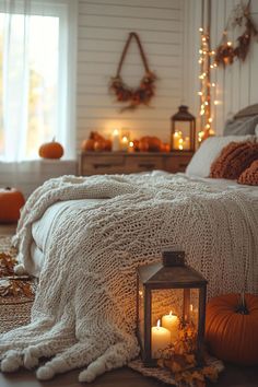 Rustic lanterns with LED candles adding a warm glow to a fall bedroom. Fall Bed, Room Reset, Autumn Bedroom Decor, Halloween Room