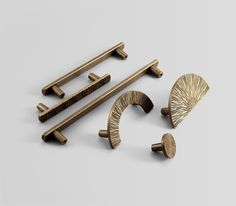 an assortment of brass handles and knobs