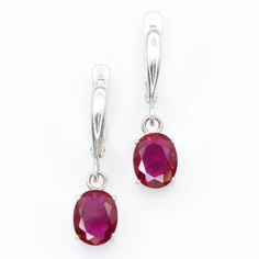 Oval Ruby Earrings set with a Created Ruby in a flawless diamond cut & clarity, deep red color, at 10x8mm (6 Cts a pair).Solid 925 Sterling Silver ☞ made to last. Click here for ☞ Matching Ring Matching Pendant ☞ please ask me Details:♥ Created Ruby in a deep red color♥ Ruby: 10x8mm each, 6 Cts a pair, diamond cut♥ Lever Back Closure - "English Lock"♥ Dimensions: Length 29mm, Width 9mm♥ Solid 925 Sterling SilverSKU 1118 Red Polished Fine Jewelry Earrings, Red Polished Finish Fine Jewelry Earrings, Red Faceted Earrings For Formal Occasions, Classic Silver Ruby Earrings, Hallmarked Oval Red Earrings, Red Oval Classic Earrings, Classic Oval Red Earrings, Classic Red Sterling Silver Earrings, Classic Red Oval Earrings