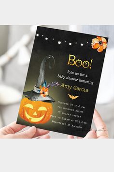 a person holding up a halloween party card