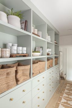 the shelves are filled with baskets and other items