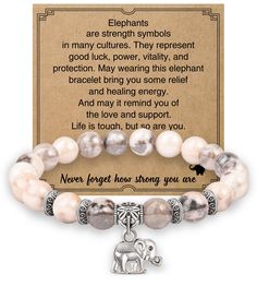 a bracelet with an elephant charm on it and a card that says, never forget those strong you are