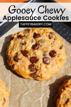 an oatmeal cookie with chocolate chips on top and the words gooey chewy applesauce cookies above it