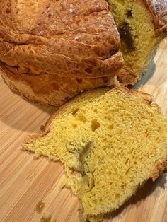 a loaf of bread sitting on top of a wooden cutting board