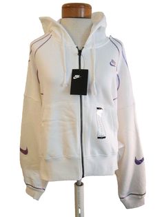 Nike Sportswear Women's Oversized Full-Zip Cropped Hoodie White/Violet size L Measurements: Shoulder to shoulder (dropped shoulder seams): 30" across Arm length (bottom of collar to sleeve hem): 32" Length: (bottom of collar to hem0): 22" Details: Body: 80% Cotton/20% Polyester Hood lining: 80% Cotton/20% Polyester Loose, oversized fit Hood with drawcord Full-zip Smooth on the outside, cozy on the inside Brushed Fleece lining Dropped shoulders and roomy sleeves provide a relaxed, oversized feel Ribbed hem and cuffs Front hand pockets Foil piping detail  Cropped hem Machine washable Style# CZ9108-100 Retail - $80.00 ** Make sure to check out many more items available at my on-line store! ** Payment is required immediately following auction or purchase.  Will ship within 24 hours of payment. Sporty Purple Sweatshirt For Spring, Purple Sportswear Sweatshirt For Sports, Purple Sporty Sweatshirt For Fall, Purple Sporty Fall Sweatshirt, Sporty Purple Fall Sweatshirt, Purple Athleisure Sweatshirt For Streetwear, Sporty Purple Hoodie For Sports, Purple Sporty Hooded Sweatshirt, Sporty Purple Hooded Sweatshirt