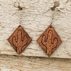 Earrings are lightweight and hand tooled from scratch. Finished product may vary slightly from the picture due to its handmade nature. Earrings are finished with silver earring hooks for easy wearing. Leather Ideas, Western Earrings, Nature Earrings, Leather Crafts, Cow Skull, Leather Projects, Earring Hooks, Silver Earring, Leather Earrings