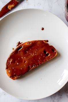 a piece of bread on a white plate