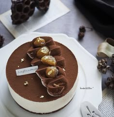 there is a chocolate cake with nuts on it