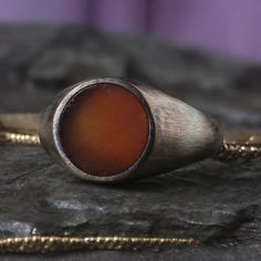 Mens Handmade Ring fathers day gifts ,valentines day gift for boyfriend Sterling Silver Ring, Red Amber Oval Minimal Men Ring ,Gemstone Handmade Sterling Silver Mens Ring, Materials  - Sterling silver ring -Bronze Discover Other Handmade Unique Rings https://www.etsy.com/shop/MaryleboneSilver?ref=seller-platform-mcnav&section_id=31993345 - Parts on it are 24-carat gold plated. PRODUCTION METHOD: - Handmade with Care INTERNATIONAL SHIPPING: - We use International Priority Shipping Service - 5-10 Business Days PACKAGING: - All handmade sterling silver rings are nicely packaged ready to gift in elegant jewelry boxes. - Gift for him, gift for father's day MAKER GUARANTEE: - All items are 925k our silversmith maker hallmark stamped Anniversary Carnelian Signet Ring With Polished Finish, Spiritual Gift Signet Ring With Polished Finish, Red Polished Finish Signet Ring As Gift, Red Signet Ring Gift, Oval Antique Signet Ring As Gift, Open Ring Signet With Gemstone For Gift, Antique Oval Signet Ring For Gift, Open Signet Ring With Gemstone As Gift, Open Signet Ring With Gemstone For Gift