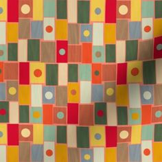 an orange, green, yellow and red pattern with circles on the fabric is shown