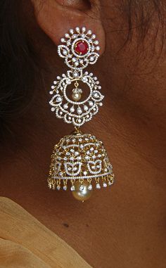 18 karat gold '4 in 1' detachable diamond jhumkas - diamond dangle earrings with color stones & culture pearls
  this product has inter changeable stones in the earrings
  width of the jhumka : 1.10 inches 


discover the luxurious 18 karat gold '4 in 1' detachable diamond jhumkas    enhance your beauty with these exquisite diamond dangle earrings crafted with precision and elegance by totaram jewelers, a trusted name in fine jewelry from india.    featuring interchangeable stones, these jhumkas Diamond Jhumkas, Enhance Your Beauty, Color Stones, Diamond Dangle Earrings, Earring Crafts, Cultured Pearls, Stone Color, 18k Gold, Dangle Earrings